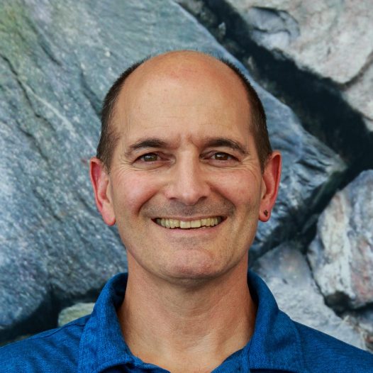 Dr. Connor Flynn’s research interests span a broad range from aerosols to clouds to air quality, but the connecting thread is probably sub-orbital measurements including both ground-based and airborne in situ and remote sensing. Connor is currently involved with airborne HSRL and in situ measurements, ground-based sun photometry and radiometry, surface measurements of aerosol optical, physical, and chemical properties and air quality, lidar remote sensing of smoke and dust, and ground-based retrievals of cloud properties. Connor is very interested in pushing the envelope of cloud/aerosol interactions to focus on the the low end, that is when aerosol burden is light and clouds are just forming and are thin and tenuos. These clouds are at or below the threshold of microwave and radar detection but are very common, have significant impacts on the SW and LW radiation balance, and are the origin of most clouds.
